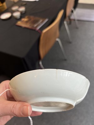 Lot 81 - A set of three Chinese famille rose tea bowls and saucers