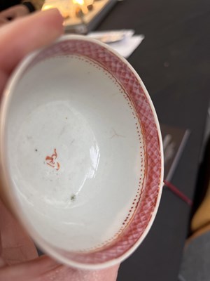 Lot 81 - A set of three Chinese famille rose tea bowls and saucers
