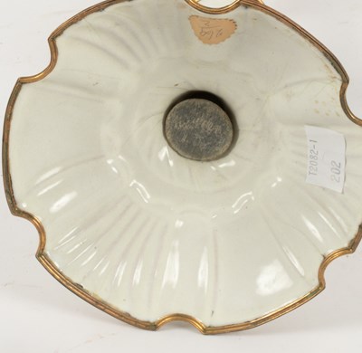 Lot 91 - A pair of South Staffordshire white enamel candlesticks