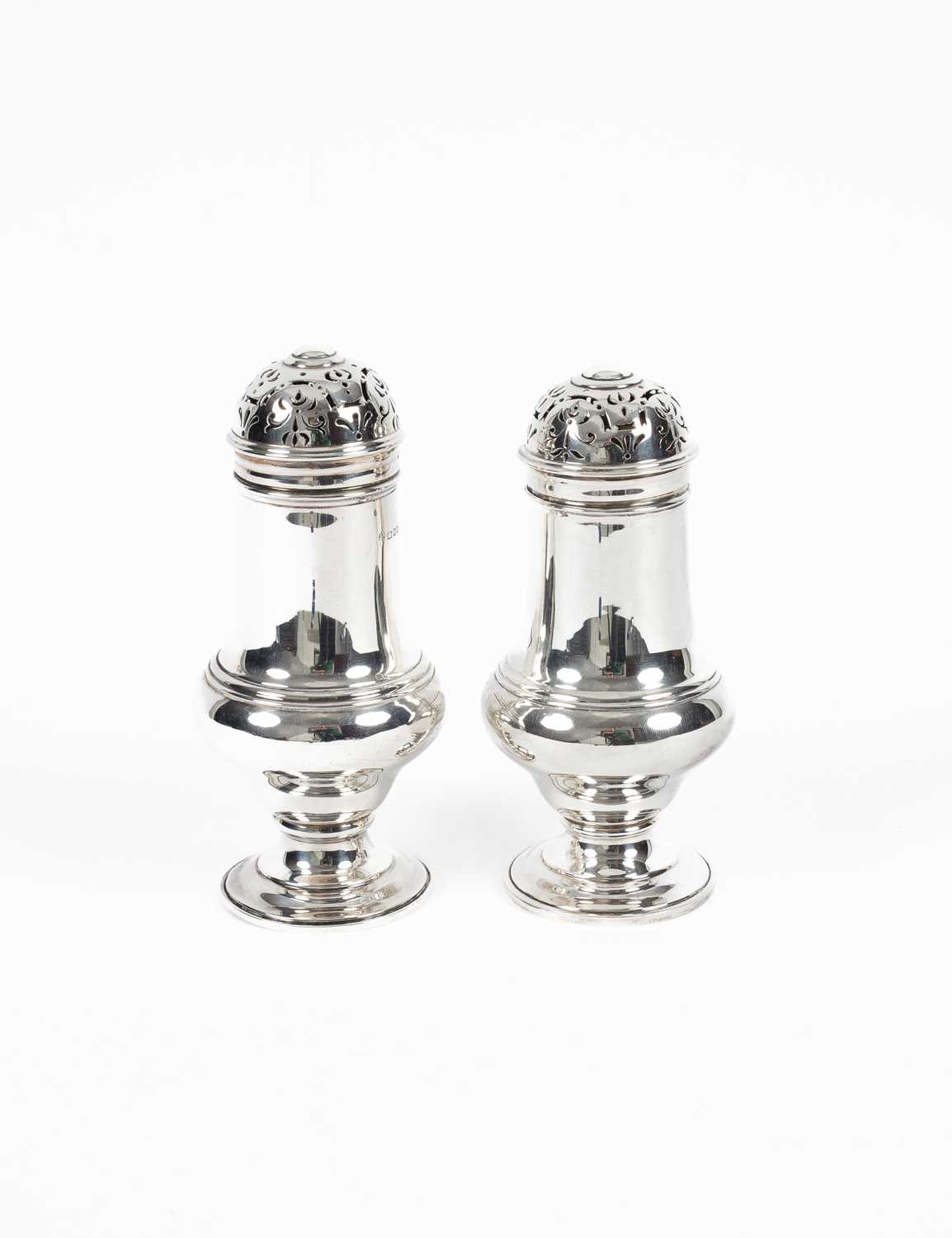 Lot 8 - A pair of silver sugar casters