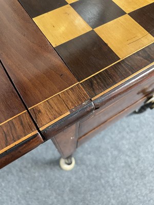 Lot 19 - A Regency rosewood banded ebony and boxwood strung games Pembroke table