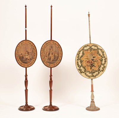 Lot 78 - A pair of late George III satinwood pole screens