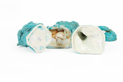Lot 37 - A pair of  Minton turquoise glazed figures of gardeners