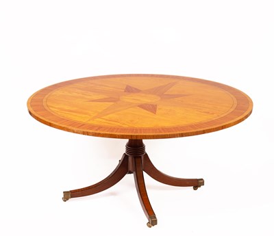 Lot 523 - A satinwood and zebrano inlaid circular tilt top dining table