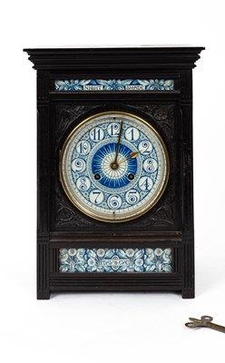 Lot 12 - Lewis Foreman Day (1845-1910) An Arts and Crafts porcelain mounted ebonised mantel clock