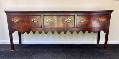 Lot 634 - A George III oak dresser base
