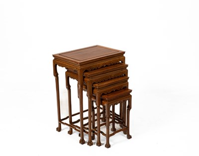 Lot 594 - A nest of four Chinese carved hardwood tables