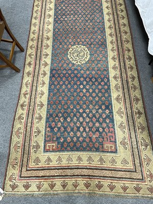 Lot 296 - A Khotan long rug