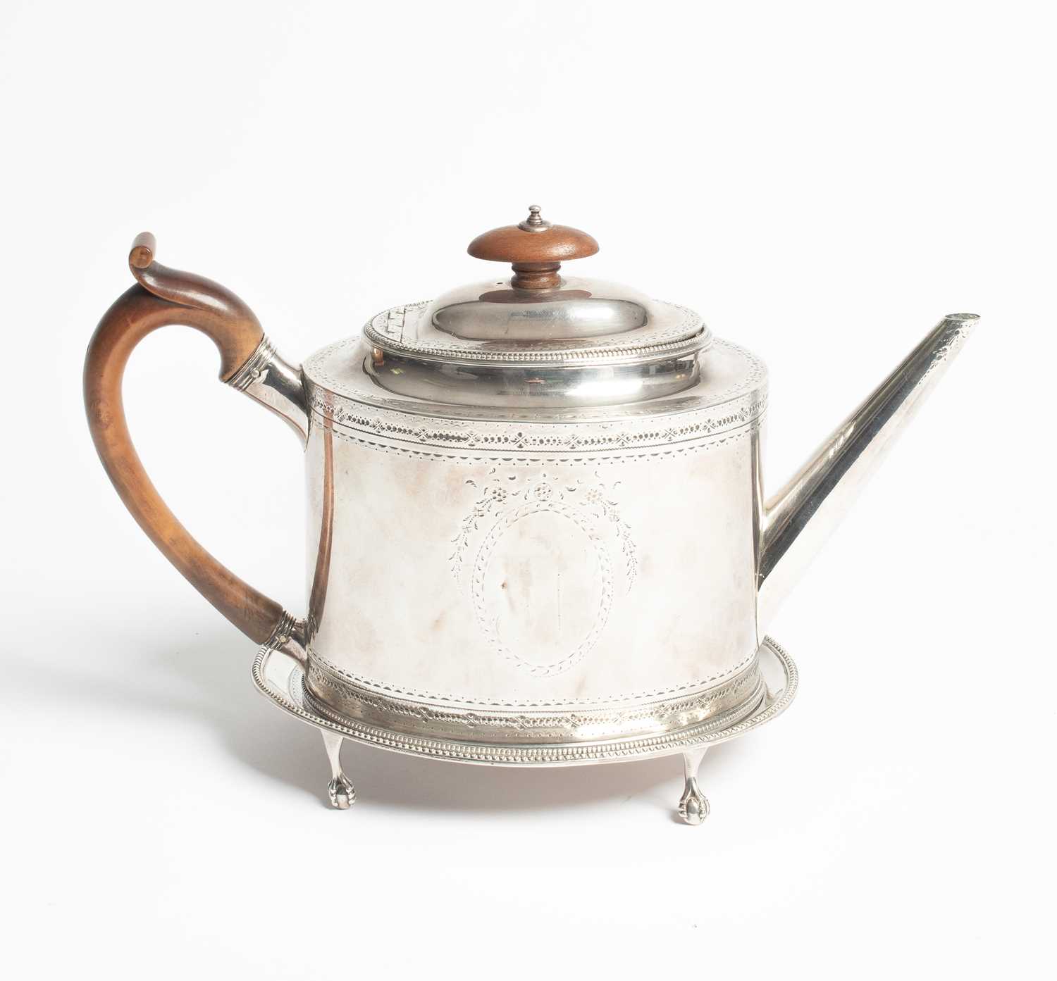 Lot 25 - A George III silver teapot and stand