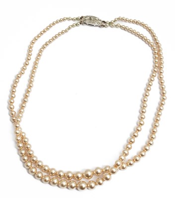 Lot 13 - A Rosita double strand of graduated simulated pearls