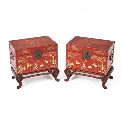 Lot 56 - A pair of Chinese red lacquered trunks on wood stands