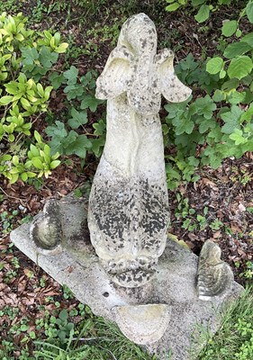 Lot 12 - A reconstituted stone figure of a dolphin