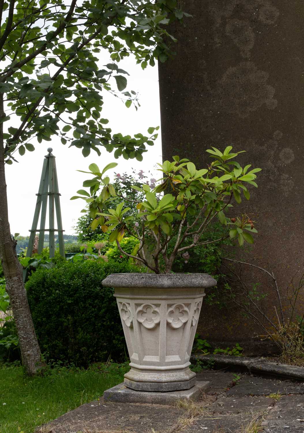 Lot 17 - A set of four Haddonstone Gothic vases