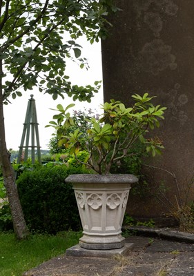 Lot 17 - A set of four Haddonstone Gothic vases