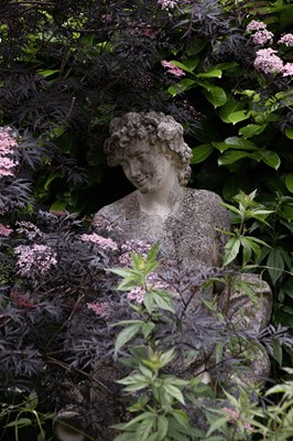 Lot 22 - A reconstituted stone figure of Bacchus