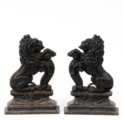 Lot 37 - A pair of cast iron lion door stops