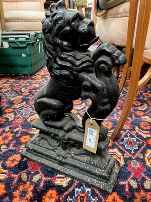 Lot 37 - A pair of cast iron lion door stops