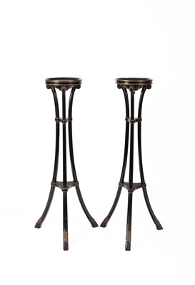 Lot 593 - A pair Regency style black and gilt painted torchères