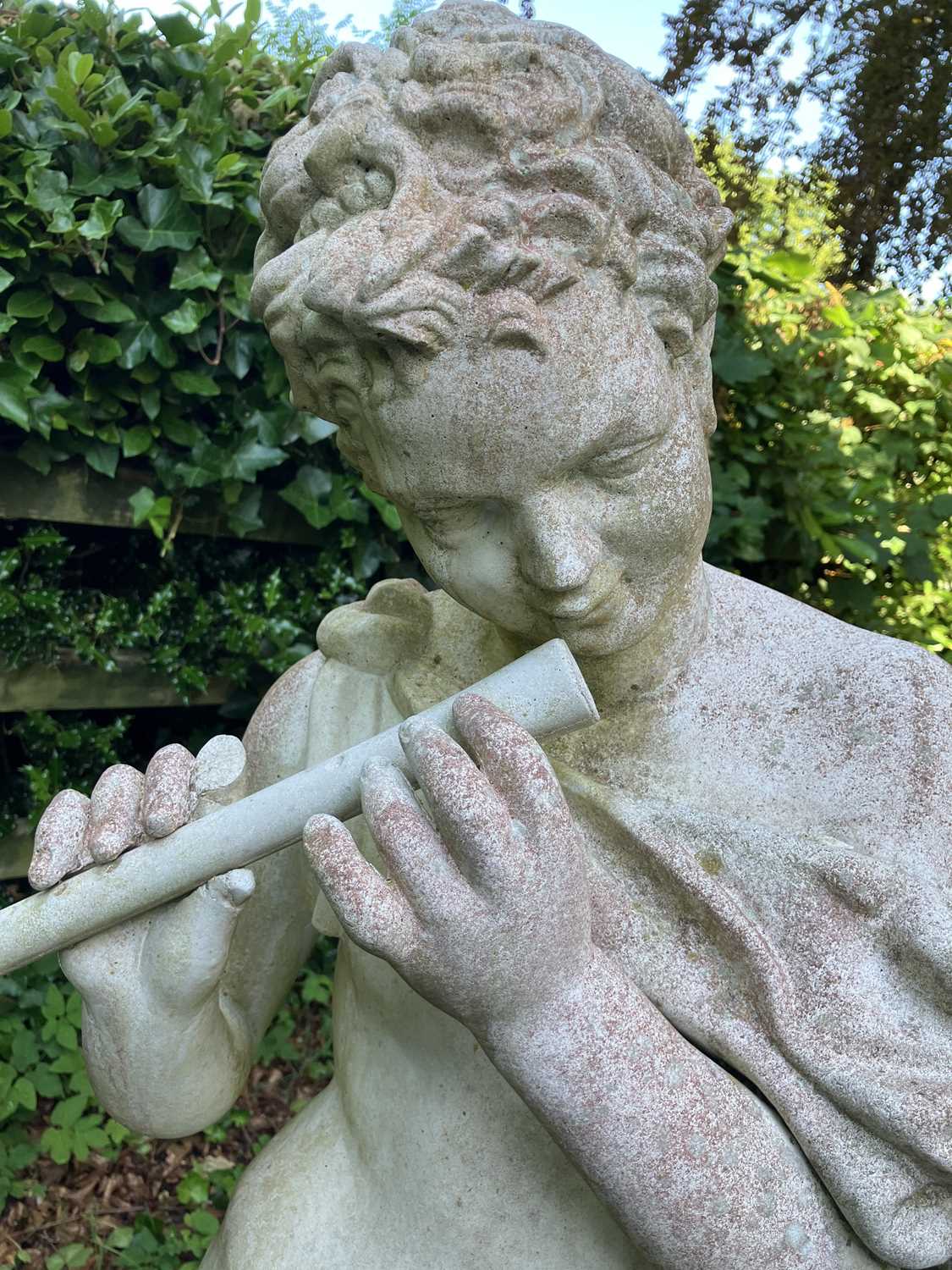 Lot 40 - A reconstituted stone figure of a youth