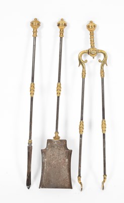 Lot 8 - A set of three brass mounted burnished steel fire irons