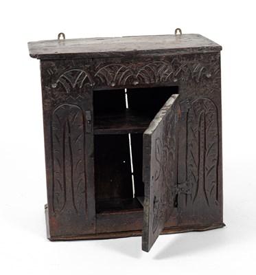Lot 12 - A small Charles II oak hanging cupboard