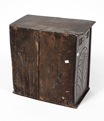 Lot 12 - A small Charles II oak hanging cupboard