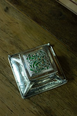 Lot 60 - An Arts & Crafts silver and green enamel inkstand
