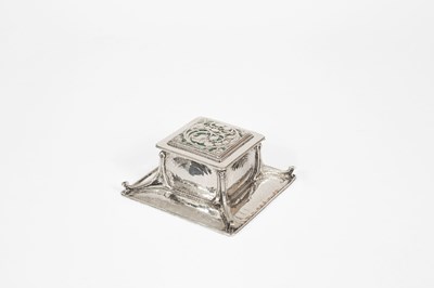 Lot 60 - An Arts & Crafts silver and green enamel inkstand