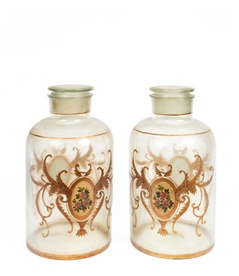 Lot 495 - A pair of large glass jars and covers
