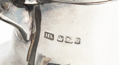 Lot 16 - A late Victorian silver hot water jug