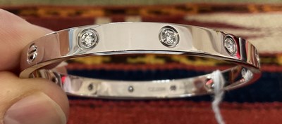 Lot 269 - Cartier - An 18k white gold and diamond love bracelet