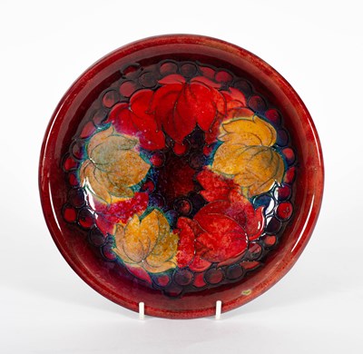 Lot 406 - A Moorcroft leaves and berries pattern flambe dish
