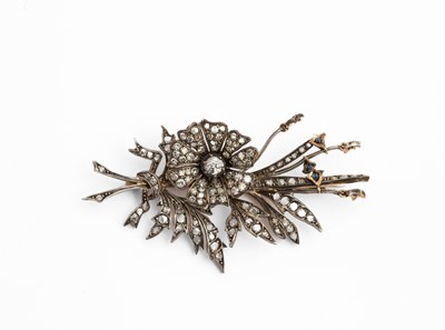 Lot 3 - A yellow metal and diamond floral spray brooch
