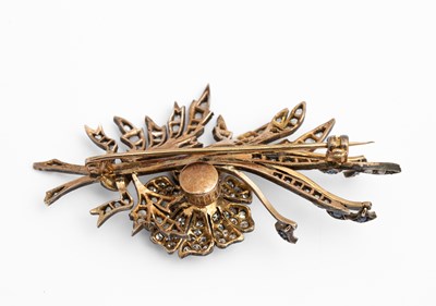 Lot 3 - A yellow metal and diamond floral spray brooch
