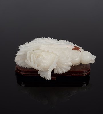 Lot 581 - A Chinese white jade carving of a cabbage