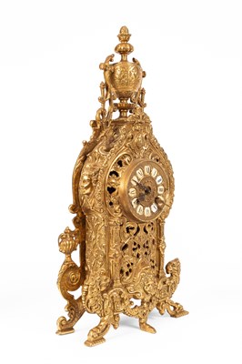 Lot 376 - A late 20th Century brass mantel clock garniture