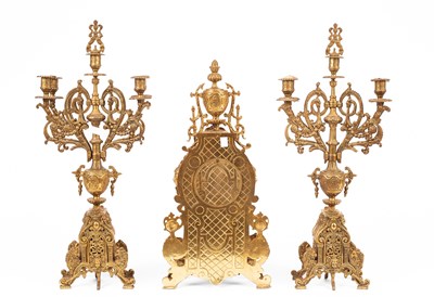 Lot 376 - A late 20th Century brass mantel clock garniture