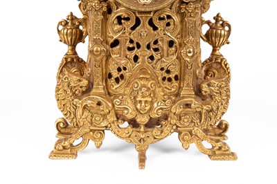 Lot 376 - A late 20th Century brass mantel clock garniture