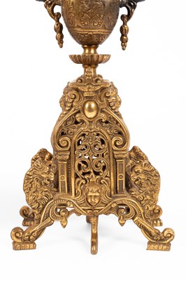 Lot 376 - A late 20th Century brass mantel clock garniture