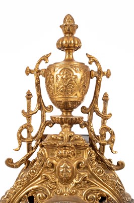 Lot 376 - A late 20th Century brass mantel clock garniture