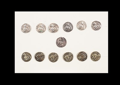 Lot 202 - A group of thirteen buttons with female heads