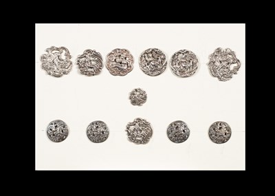 Lot 206 - A group of twelve silver buttons decorated with reclining figures