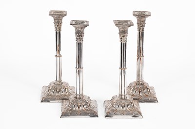 Lot 58 - A set of four Sheffield plated cluster column candlesticks