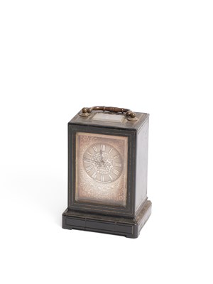 Lot 387 - A French ebony veneered mantel timepiece