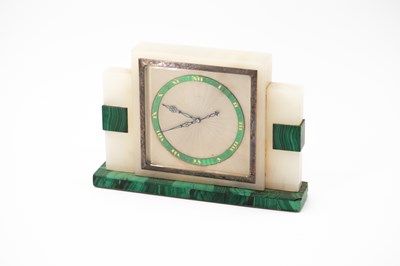 Lot 381 - An onyx and malachite mantel timepiece