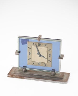 Lot 384 - An Art Deco style glass and chrome plated mantel timepiece