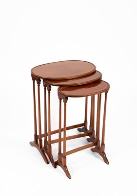 Lot 329 - An Edwardian nest of three oval mahogany tables
