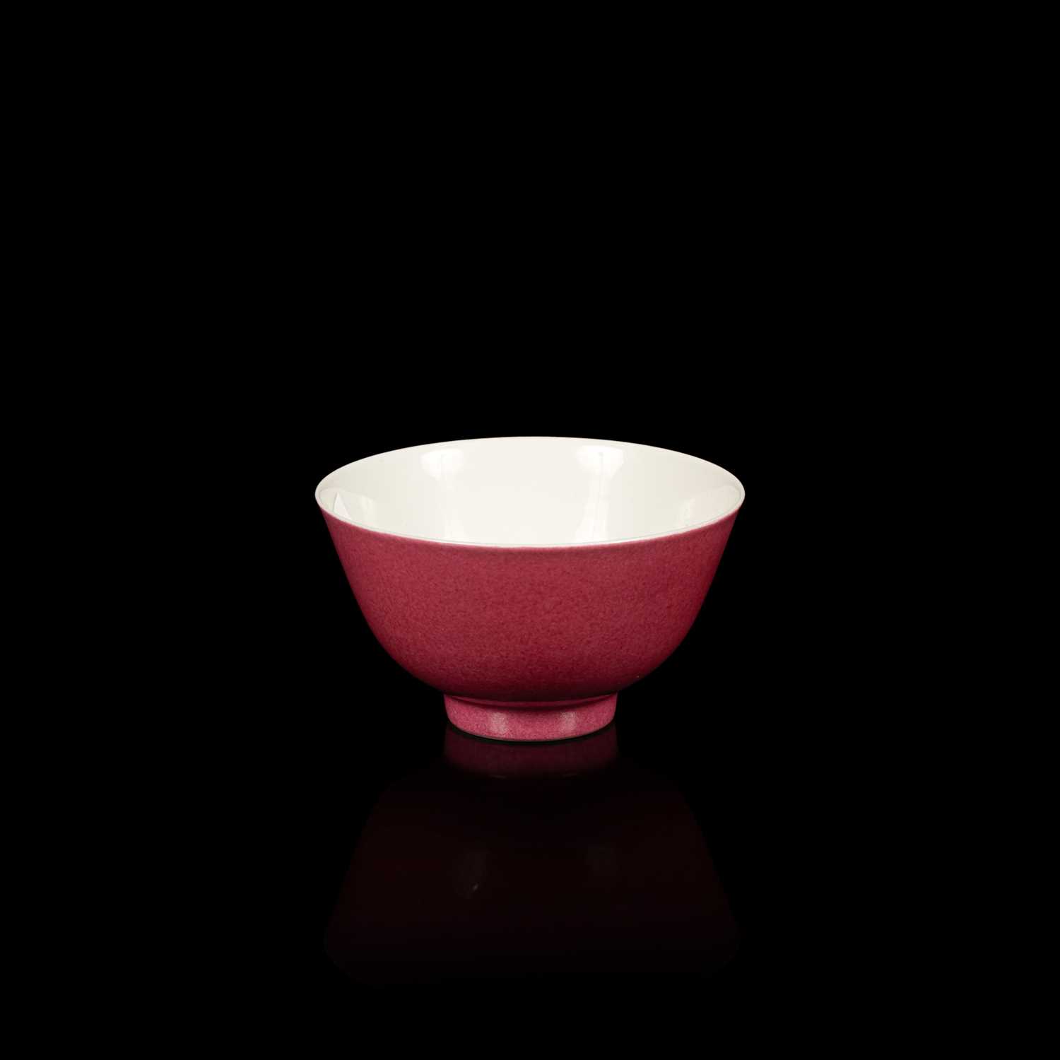 Lot 574 - A small pink monochrome bowl