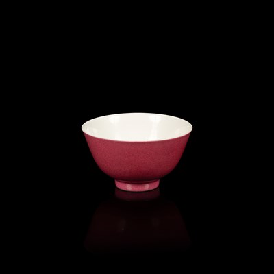 Lot 574 - A small pink monochrome bowl
