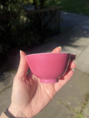 Lot 574 - A small pink monochrome bowl